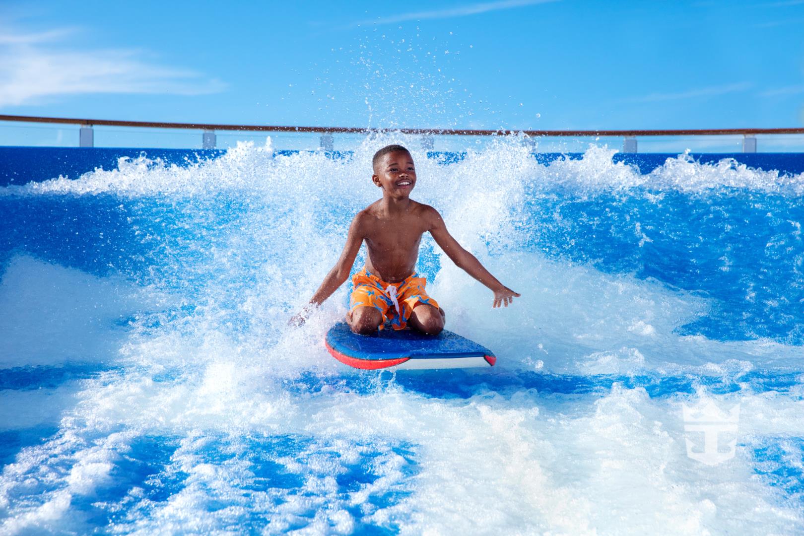 View of little boy surfing on the FlowRider